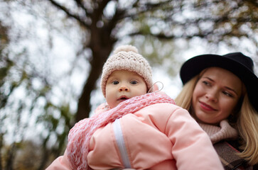 Beautiful baby girl with mother outdoors. Family outdoor