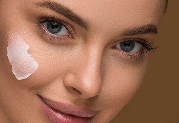 Cream on cheek face woman beauty healthy skin close up portrait
