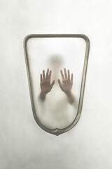 person imprisoned in a mirror, concept of identity crisis