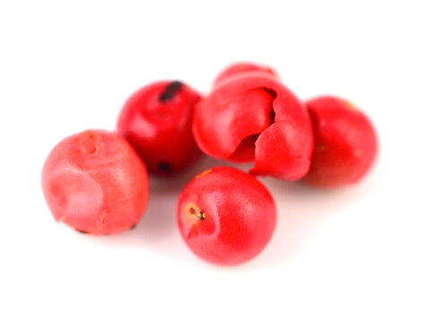 Macro Whole Pink Pepper. Isolated On White.