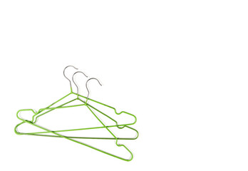 Fototapeta premium Metal clothes hangers on a light background. Wardrobes were hung for clothes. Place for text