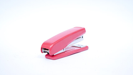 Fototapeta na wymiar pink stapler isolated white background