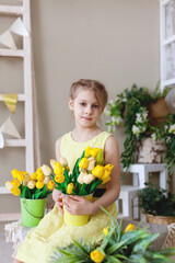 Pretty girl with spring bouquet tulip flowers