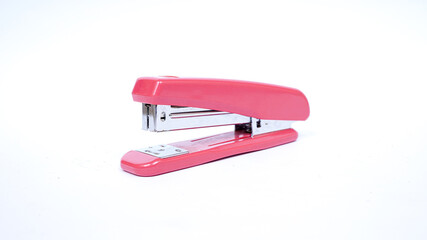 pink stapler isolated white background