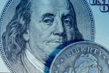 One hundred US Dollar bill and coin with description: Liberty as symbol: America - the land of...