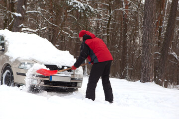 shoveling snow from car, man shoveling snow
