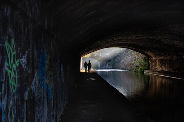 An image from a walk along the Birmingham Canal,  the graffiti and the sunlight at the tunnels end caught my attention.  Then a young couple walked past and just seemed to complete the scene
