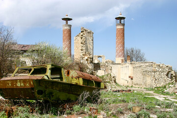 Destroyed armored vehicle, and Ruins of the Azerbaijani part of Shusha