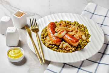 English pork sausage with green peas, top view