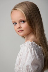 portrait of a girl child with beautiful hair on a white background