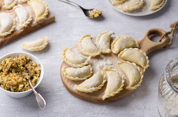 Homemade raw frozen vegan dumplings, vareniki, pierogi, kreplach  stuffed with vegan lentil 