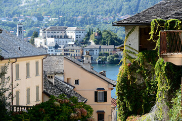 Fototapeta na wymiar Orta is a wonderful village on Lake Orta in Piedmont. Opposite is the magical island of San Giulio that can be reached by a motorboat. Orta is perhaps the nicest lake village in northern Italy.