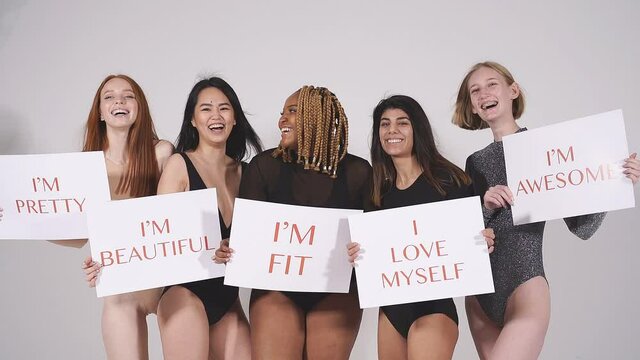 Optimistic young models of different body size for bodypositive, convey the idea of loving yourself, be who you are.