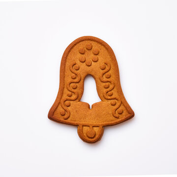 New Year gingerbread or Christmas bell shaped cookies isolated on white background. Square image. Top view.