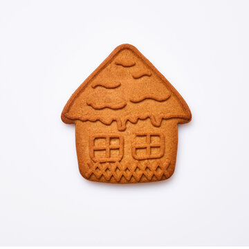 New Year gingerbread or small house shaped cookies isolated on white background. Square image. Top view.