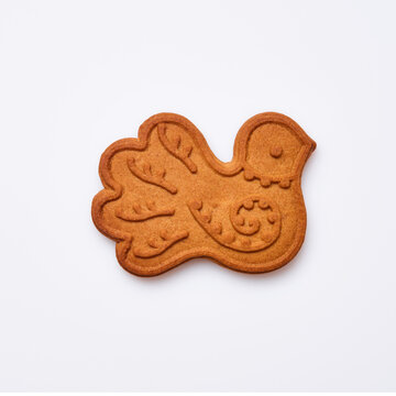 New Year gingerbread or bird dove shaped cookies isolated on white background. Square image. Top view.