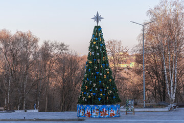 beautiful artificial tree with toys in the park
