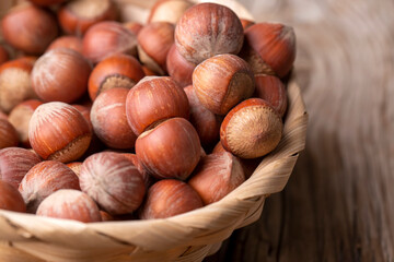 Hazelnut on the wooden background