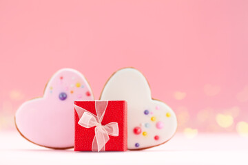 Red gift box with two hearts shaped gingerbread for Valentines Day, Mother Day or Birthday.