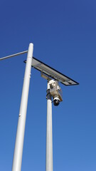 Fototapeta na wymiar Security Camera in the Public with Solar Panel