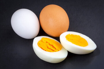 Boiled egg served on a black background