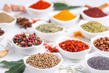 Assorted various spices on white background