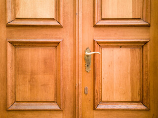 Front door made of solid wood with carved decorations. Haustür aus Massivholz mit geschnitzten...