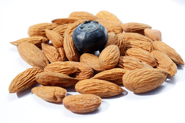 blackberry with nuts, healthy food on white isolated background 