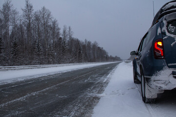 The road through snow and frost. A deserted track in the North in severe frost is a test for a car and a person.