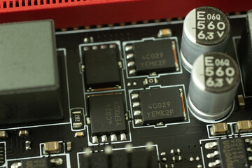 Transistors, chips and other elements on the motherboard electric circuit close-up