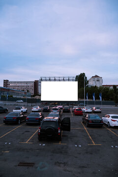 Cars Parked In Front Of Drive-in Cinema Screen