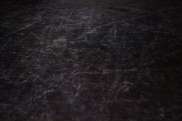 The texture of scratches on fabric on a black background, the texture of a silver reflector in the light