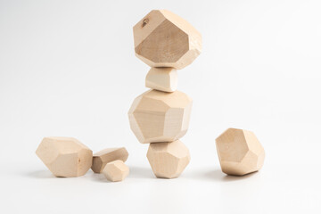 Tumi-ishi puzzle game. Construction of an unstable wooden block tower. The process of the game. Stones for Rock Balance.