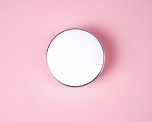 Face compact makeup powder. Realistic cosmetic powder in the white round plastic case with mirror....