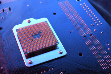 Computer cpu processor chip on circuit board ,motherboard background. Close-up. With red-blue...