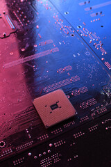 Computer cpu processor chip on circuit board ,motherboard background. Close-up. With red-blue...