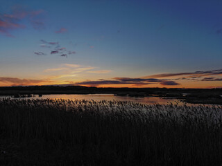 Sunset over the reedbeds on the wetlands at St Aidans Nature reserve