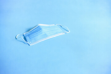 Medical protective mask on a blue background.