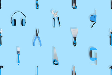 Tools seamless pattern. Various construction tools on a blue background.