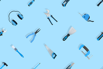 Tools seamless pattern. Various construction tools on a blue background.