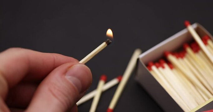 Lighting up Match in hand slow motion footage