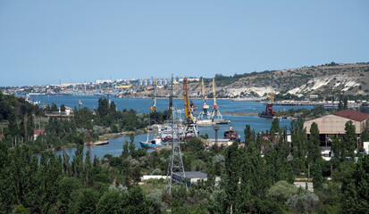 Fototapeta na wymiar Panorama of Inkerman Bay with cranes, Crimea