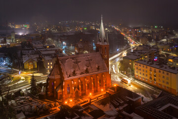 Aerial view of the old town square in Koscierzyna city by night, Poland
