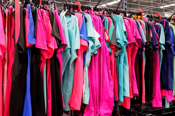 Activewear t-shirts on the rack at the sport warehouse store - obrazy, fototapety, plakaty