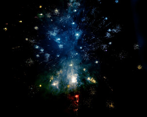 Fireworks in the night sky. Explosions of fireworks against the dark sky.