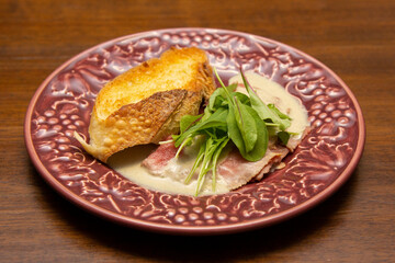 Vitello Tonnato with parmesan cheese tostata (parmigiano reggiano).