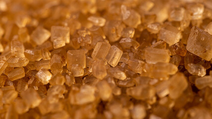 Close-up of brown cane sugar texture. Sweetness
