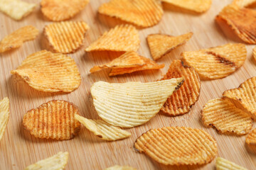 Potato chips with tomato ketchup isolated on white background
