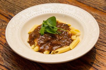 Penne pasta with oxtail ragout sauce.