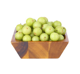 Indian gooseberry fruits in wooden bowl on white background